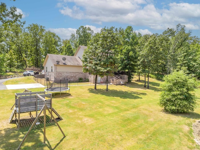 view of yard with a trampoline