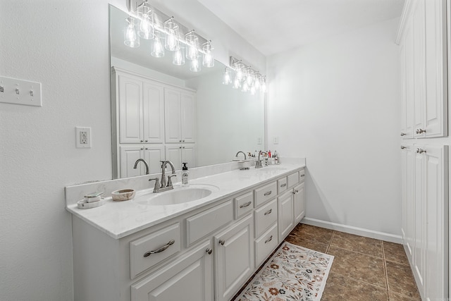 bathroom featuring dual vanity and tile patterned flooring