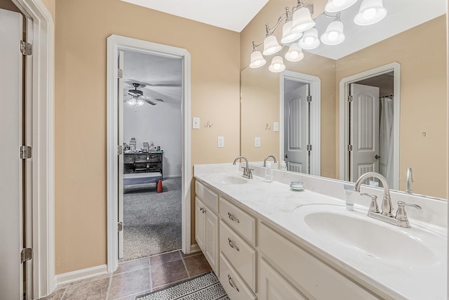 bathroom featuring tile patterned floors, ceiling fan, and dual bowl vanity