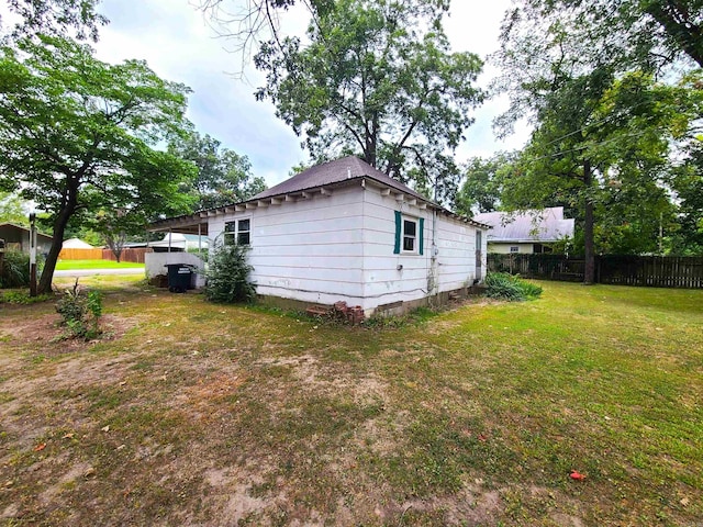 187 N Monroe St, Piggott, AR 72454 - view of property exterior featuring a lawn