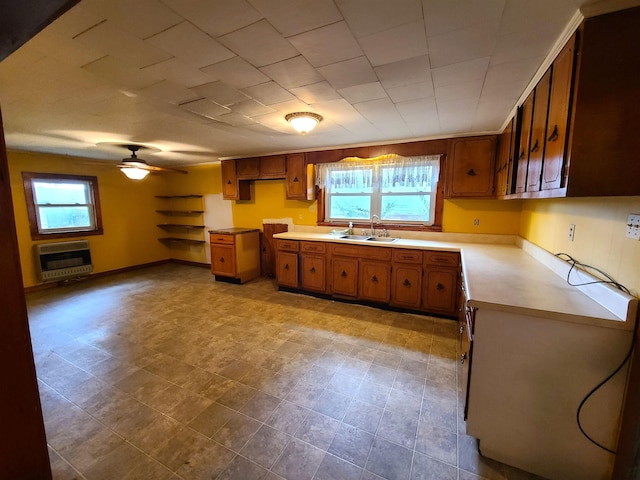 187 N Monroe St, Piggott, AR 72454 - kitchen with ceiling fan, a healthy amount of sunlight, sink, and heating unit