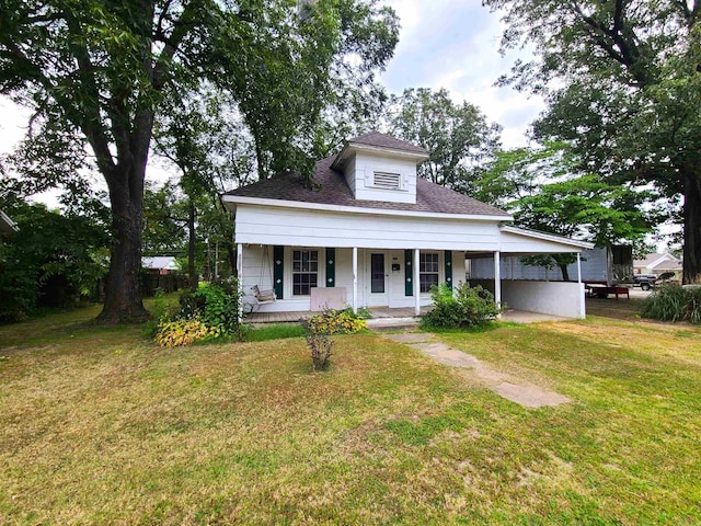187 N Monroe St, Piggott, AR 72454 - view of front of home featuring a porch and a front yard