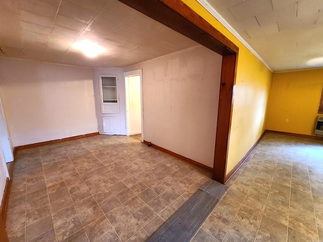 187 N Monroe St, Piggott, AR 72454 - spare room with crown molding and heating unit