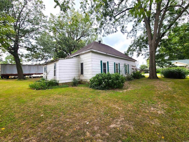 187 N Monroe St, Piggott, AR 72454 - view of home's exterior with a yard