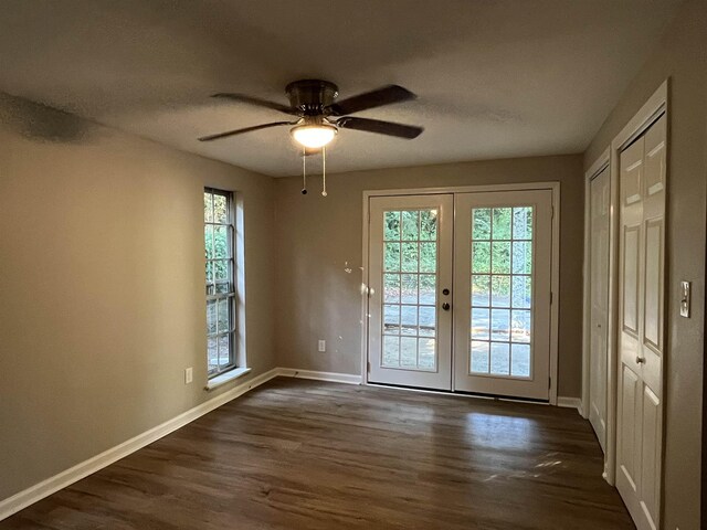 doorway to outside featuring french doors, ceiling fan, and dark hardwood / wood-style floors