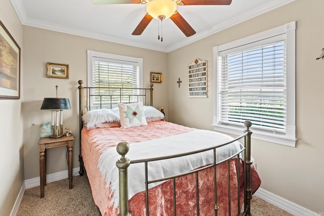 bedroom featuring a ceiling fan, crown molding, baseboards, and carpet flooring