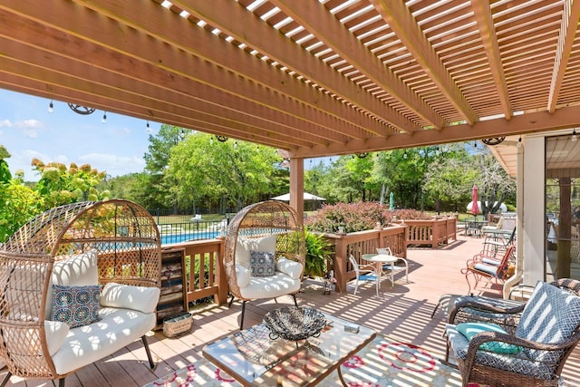 view of patio featuring outdoor lounge area, a wooden deck, a pool, and a pergola