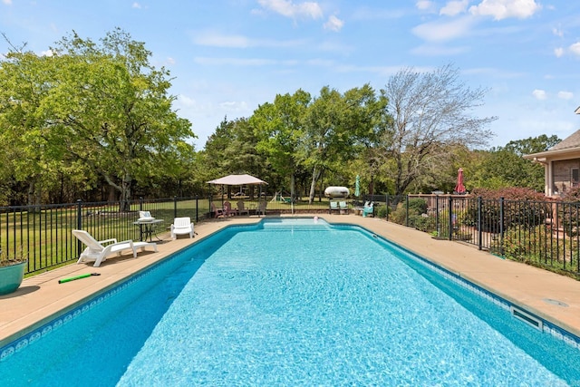 view of pool featuring a patio, fence, and a fenced in pool