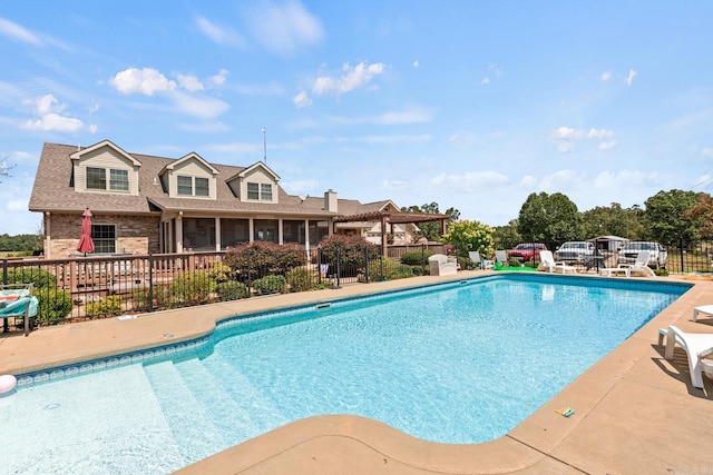 view of pool with a patio area, fence, and a fenced in pool