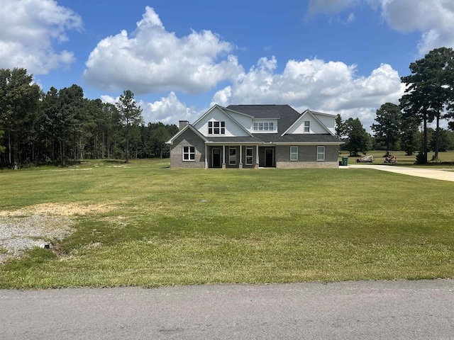 craftsman-style home with a front yard