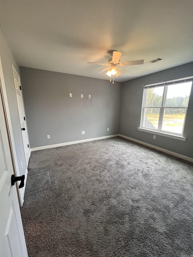 carpeted empty room with ceiling fan