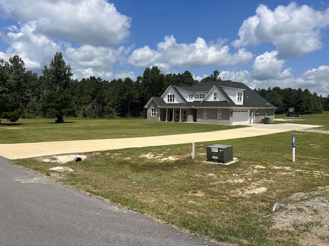 farmhouse inspired home with a front yard and a garage