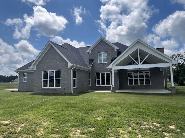 back of house featuring a yard