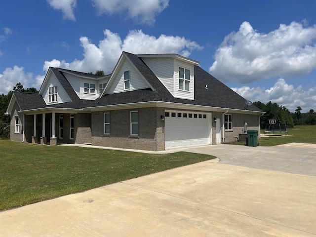 view of front of house featuring a front lawn and a garage