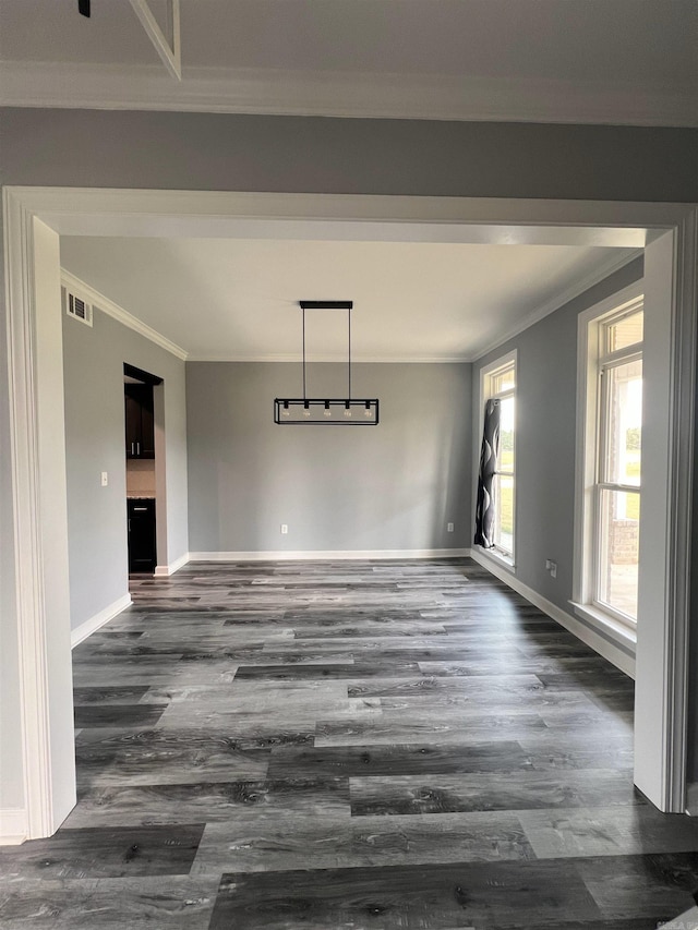 unfurnished dining area featuring hardwood / wood-style flooring and ornamental molding