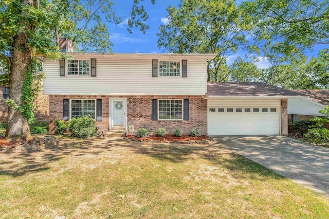 view of front facade with a garage and a front yard