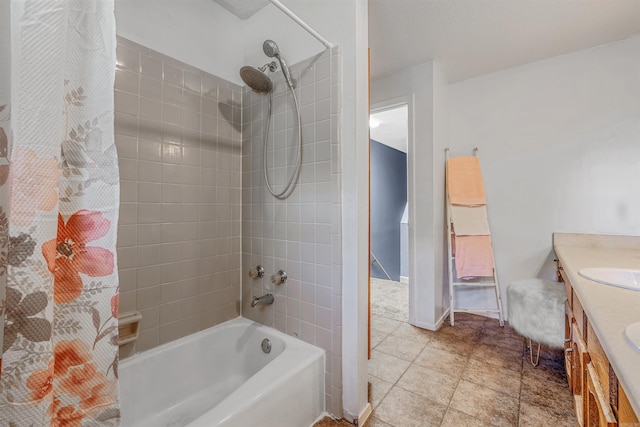 bathroom with tile patterned flooring, vanity, and shower / tub combo