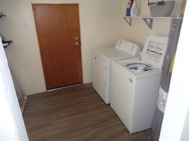 clothes washing area with dark wood-type flooring and washing machine and dryer