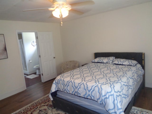 bedroom featuring ceiling fan, dark hardwood / wood-style flooring, and ensuite bath