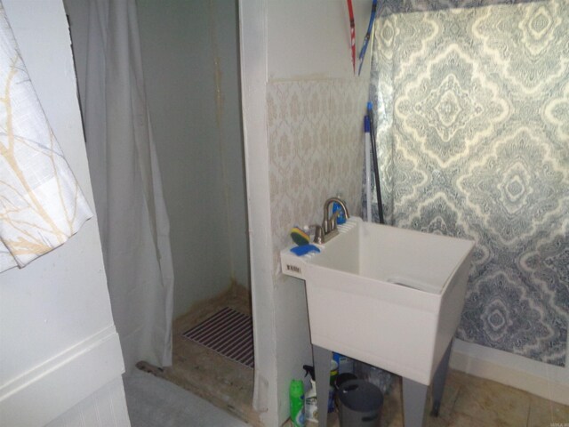 bathroom with sink and tile patterned floors