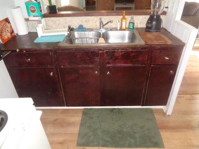 kitchen featuring sink and light hardwood / wood-style flooring