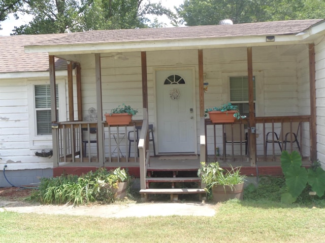 doorway to property featuring a porch