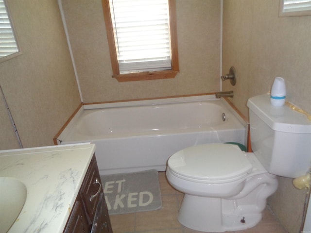 bathroom with tile patterned flooring, toilet, and vanity