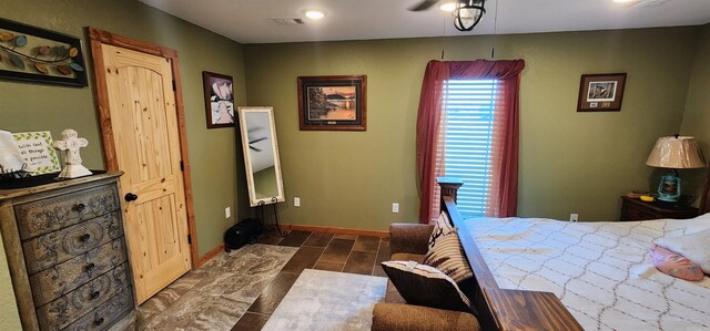 bedroom featuring dark tile patterned flooring