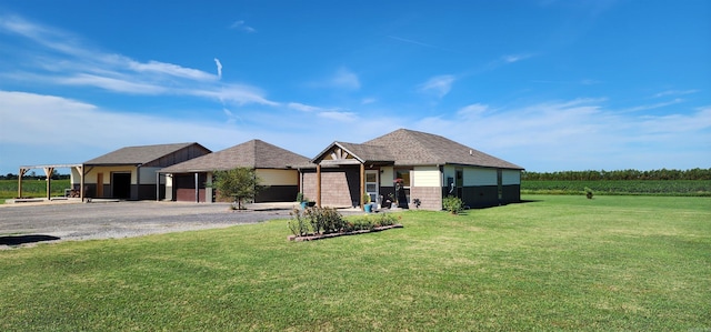 single story home featuring a front yard and a garage