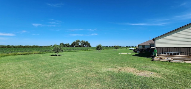 view of grassy yard with a view of countryside