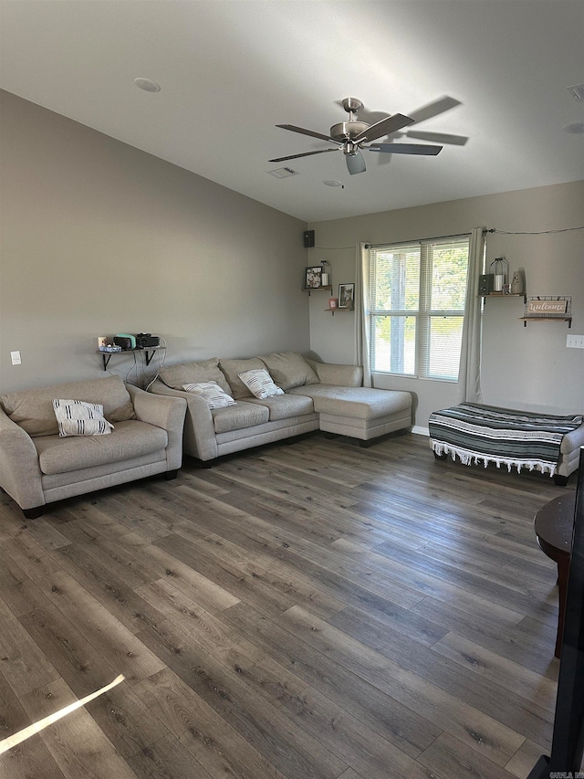 living room with ceiling fan and dark hardwood / wood-style floors