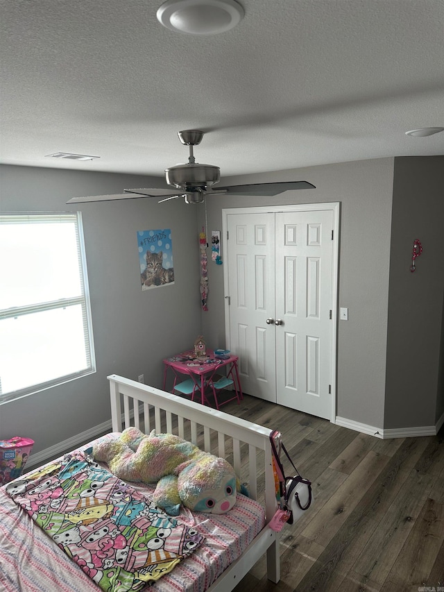 bedroom featuring a closet, ceiling fan, and hardwood / wood-style flooring