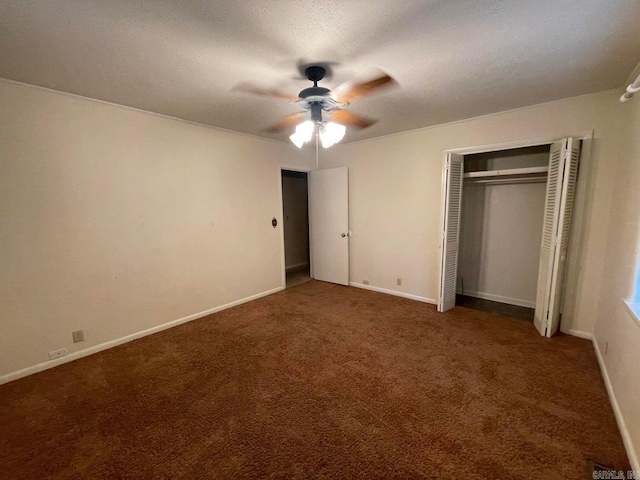 unfurnished bedroom with carpet floors, ceiling fan, and a closet