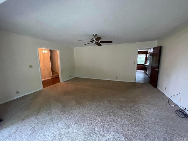 spare room featuring carpet flooring and ceiling fan