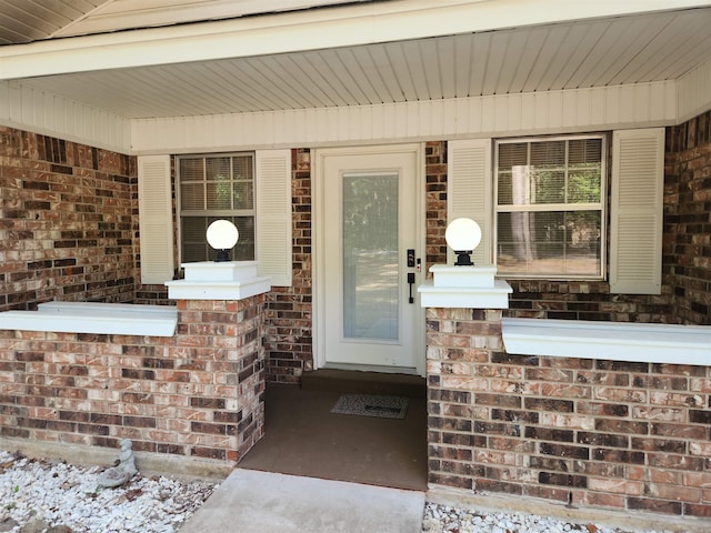 entrance to property with brick siding