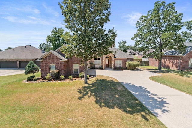 ranch-style home with a front yard and a garage