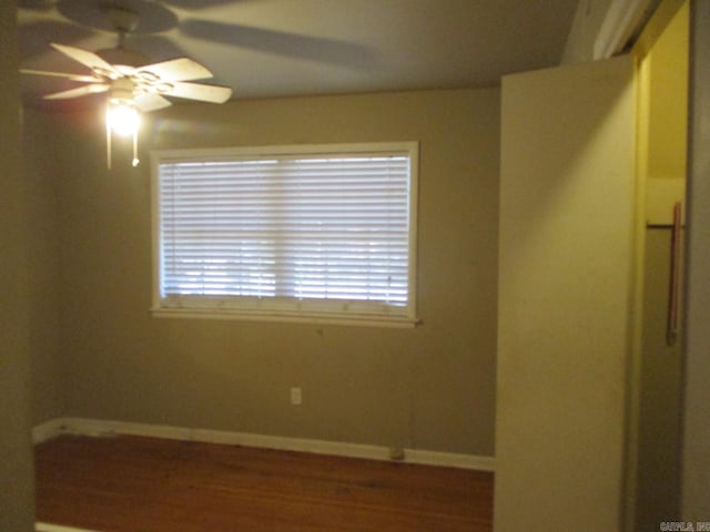 unfurnished room with hardwood / wood-style flooring