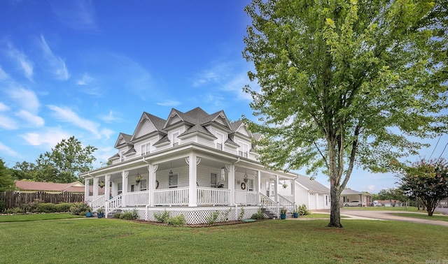 view of home's exterior featuring a garage, a porch, and a yard