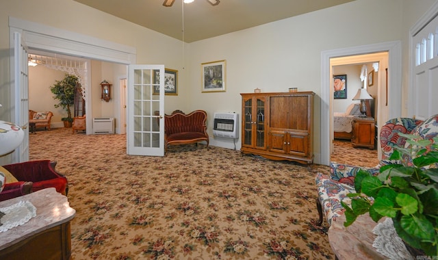 interior space featuring ceiling fan, carpet, french doors, and heating unit