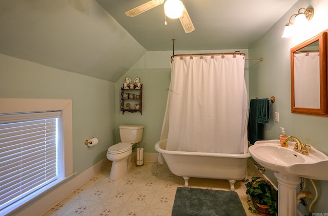 bathroom featuring ceiling fan, toilet, vaulted ceiling, and tile patterned floors