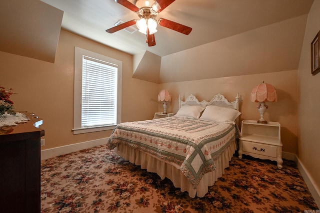 carpeted bedroom with ceiling fan and lofted ceiling