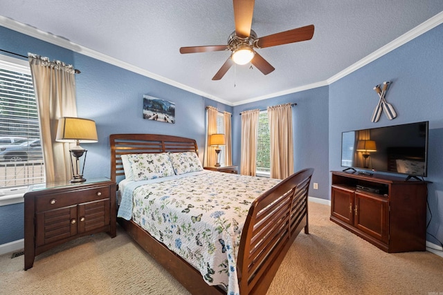 bedroom featuring ceiling fan, crown molding, light colored carpet, and a textured ceiling