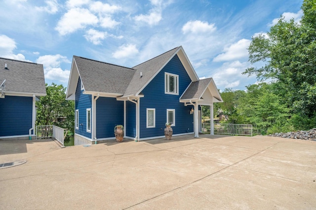 view of side of property with a patio area