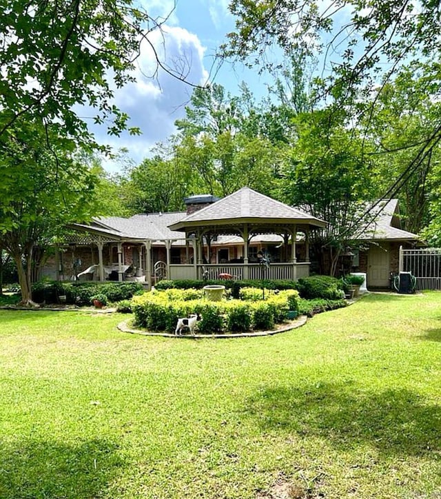 exterior space with a yard and a gazebo