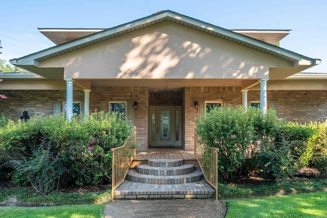 doorway to property with a porch