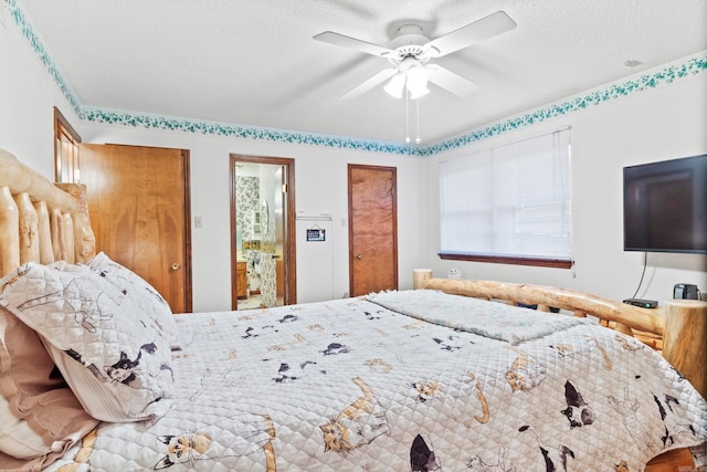 bedroom featuring ceiling fan, two closets, and a textured ceiling