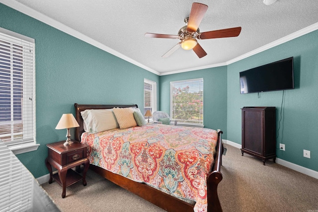 carpeted bedroom with a textured ceiling, ceiling fan, and crown molding