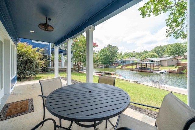 view of patio featuring a water view