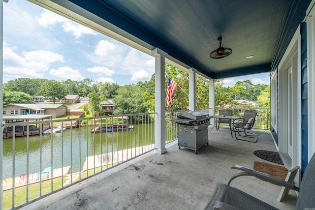 view of patio / terrace featuring a water view and area for grilling