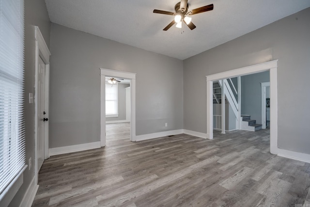 spare room featuring ceiling fan and wood-type flooring